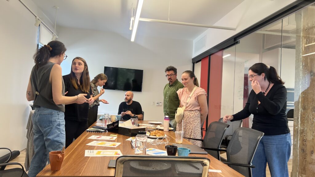 Fundraising professionals engaging around the table at a Jeffersonian Dinner hosted by raisin Software.